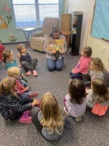 PreK kids reading in a circle